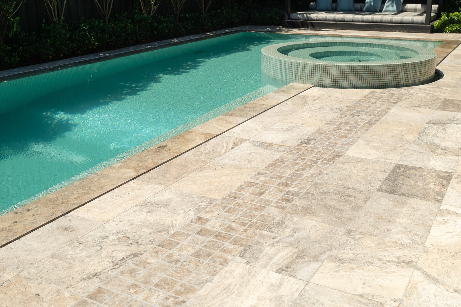 Travertine pool surround at a prestige residential property, pool and spa with full stone paving